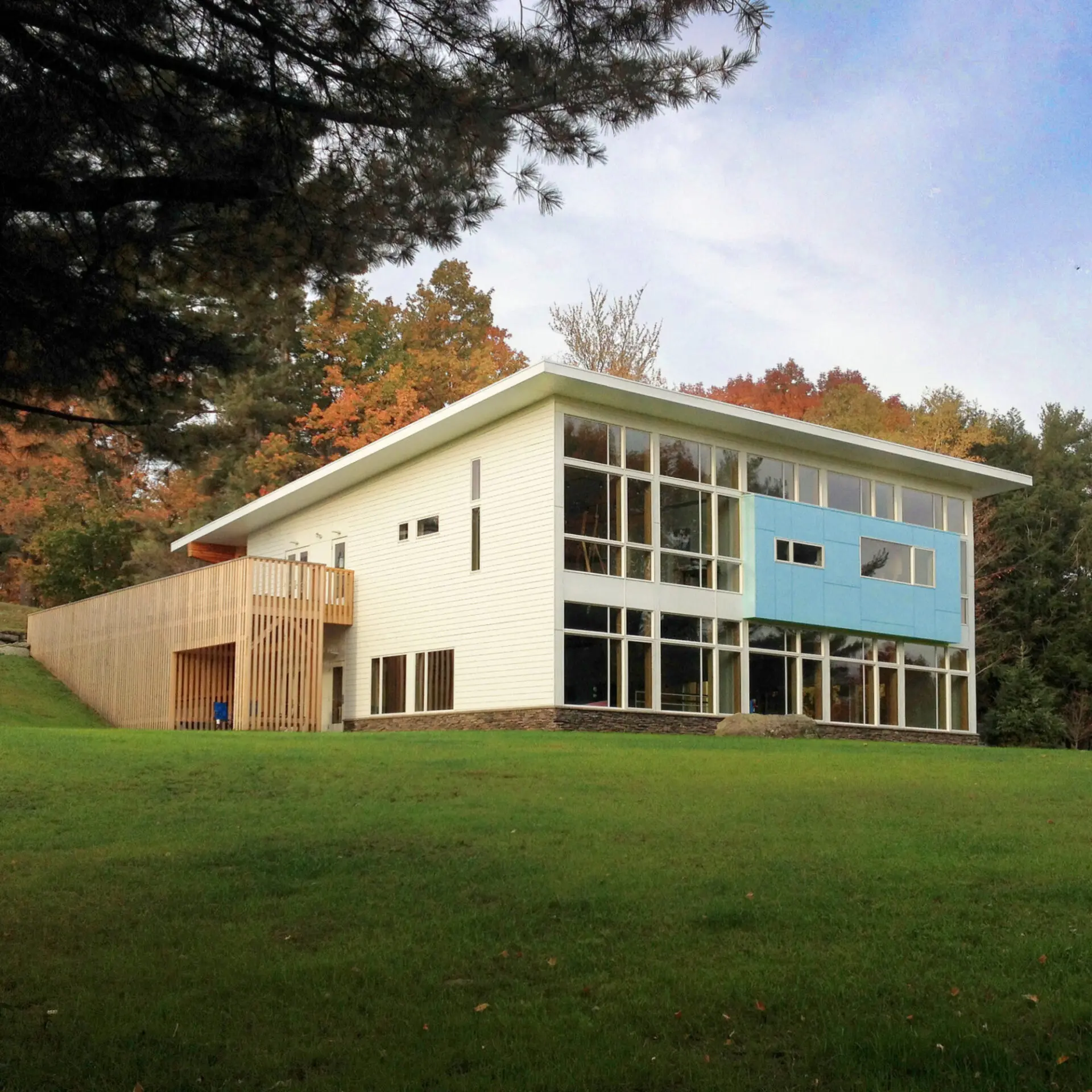 exterior of modern school with large grassy area