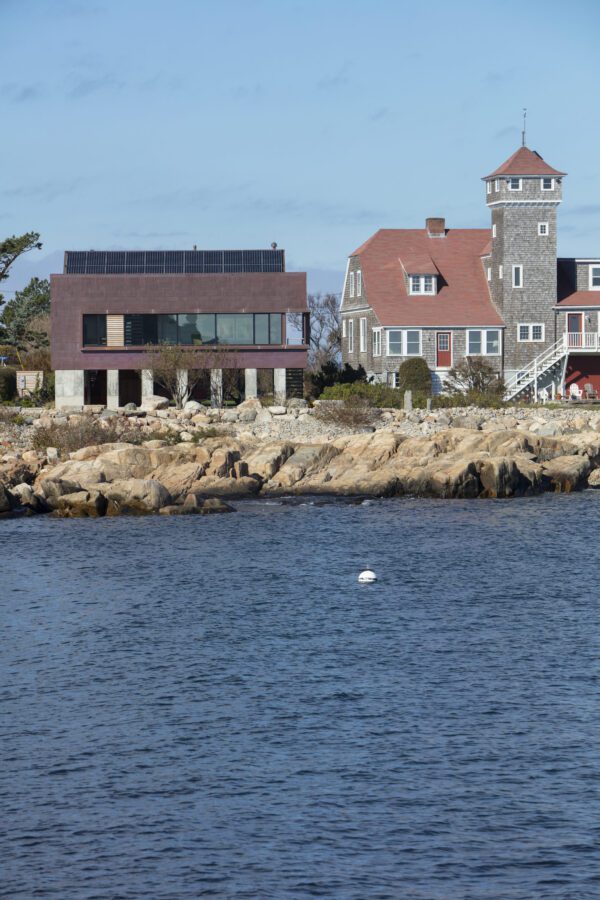 Coastal getaway designed for three generations, with a modern exterior and accessible entry